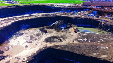 Aerial view of open pit mine with heavy machinery Stock Footage 329624122