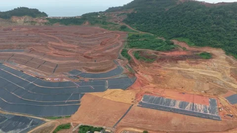 Aerial view of open pit mining operations and deforestation Stock Footage 328919768
