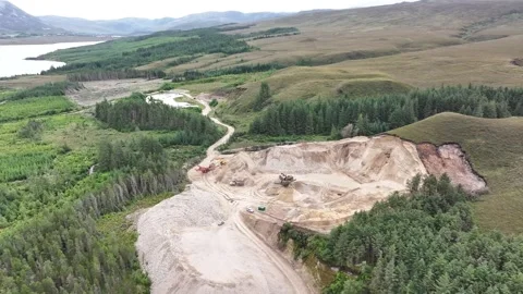 Aerial View Of Open Pit Mining Machinery Working In Green Forest Stock Footage 345544561