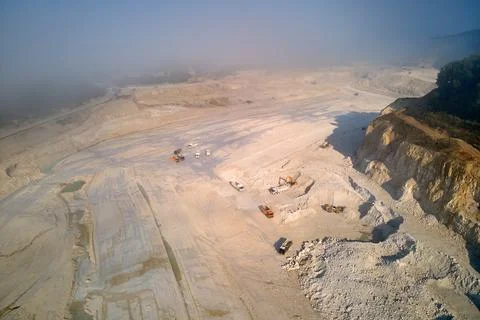 Aerial view of open pit mining of limestone materials for construction industry Stock Photos