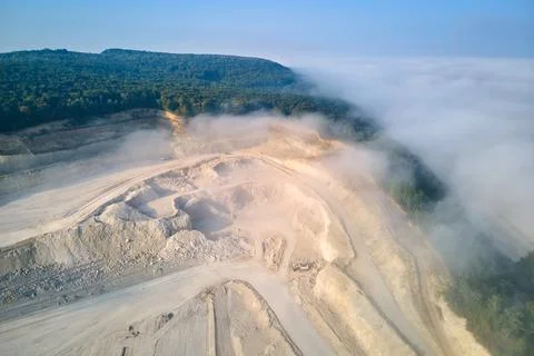 Aerial view of open pit mining of limestone materials for construction industry Stock Photos