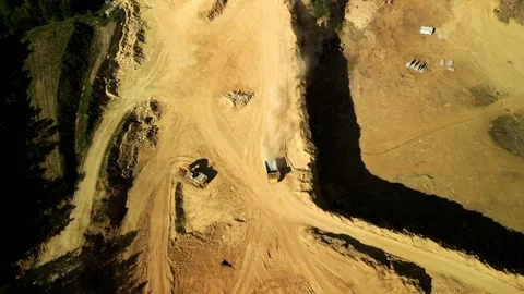 Aerial View of Open-Pit Quarry with Truck and Dust Clouds This aerial view from Stock Footage 277358116