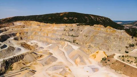 Aerial view of open pit quarry terraces and hills. Wide perspective of terr.. Fotos de archivo