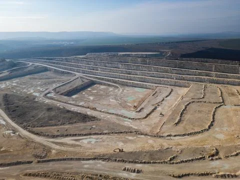 Aerial View of Open Pit Quarry Mining Excavation Site Stockfoto's