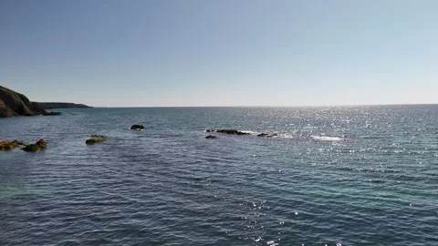 Aerial View of Open Sea with Rocks in Water in 4K Видео 332942903