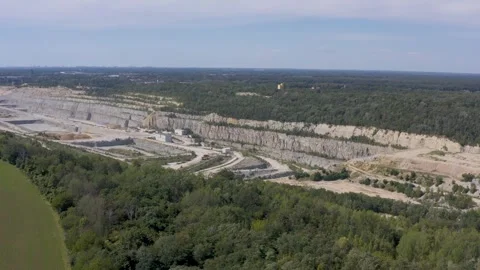 Aerial View in to the opencast mining, cement factory, Germany Stock Footage 345083573