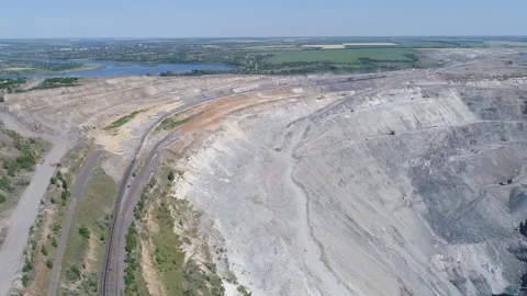 Aerial view of opencast mining quarry with lots of machinery at work - view from Stock Footage 103251086