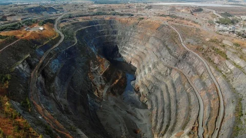 Aerial view opencast mining quarry with machinery at work Video stock 120602310