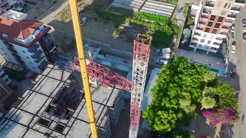 Aerial View: Operator climbs ladders and assembles parts with care and expertise Vídeo Stock 296024056