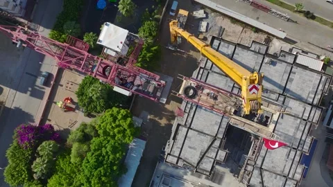 Aerial View: Operator climbs tall ladders confidently, mounting parts with care Vídeo Stock 296026023