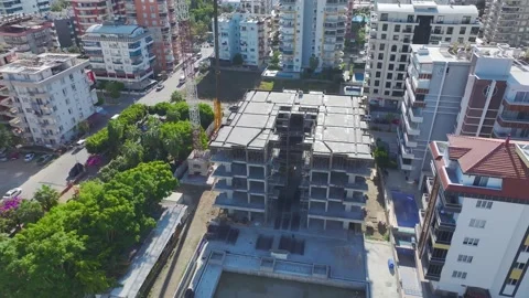 Aerial View: Operator confidently climbs ladders and mounts parts of a massive Vídeo Stock 296021886