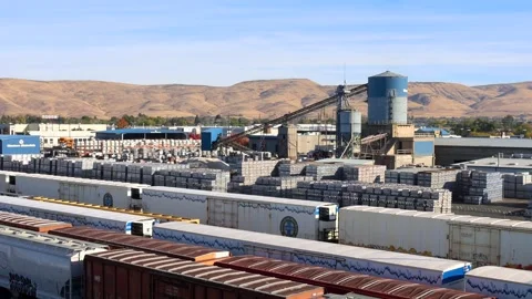 Aerial view or many container trains and industrial park at Rail road logis.. Video stock 326181349