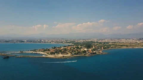 Aerial view of the orange rooftops of the old coast city from the mediterranean Stock Footage 77457879