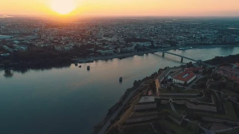 Aerial view of orange sunset over Petrovaradin fortress and Novi Sad, Serbia. Stock Footage 125528134