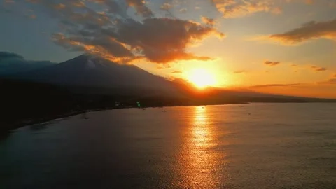 Aerial View of Orange Sunset Reflecting on Bali Bay, Amed, Indonesia Stock Footage 340841607