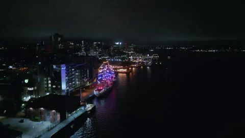 Aerial view, orbit of an old sailing ship docked in the port of Halifax, Canada. Stock Footage 250275745