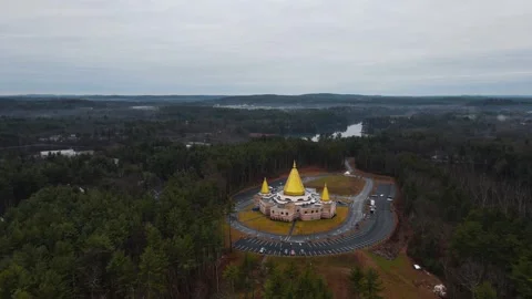 Aerial view orbiting a buddhist golden temple in the forest Stock Footage 337690290