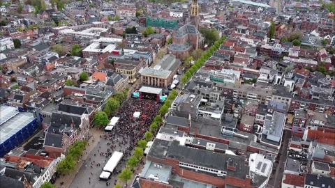 Aerial view orbiting crowd of people celebrating Kings day on the Fish market. Video stock 188145033
