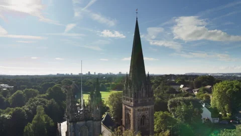 Aerial view orbiting a gothic church spire 스톡 동영상 336773910