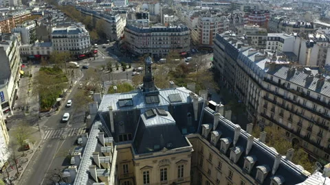 Aerial view orbiting old buildings in downtown Paris, sunny, spring day in Stock Footage 308902873