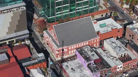 Aerial view orbiting the Ryman Auditorium, sunny, fall day in Nashville, USA Stock Footage 300747389