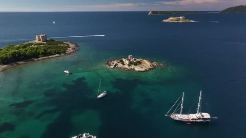 Aerial view of Otocic Gospa showcasing stunning waters, boats, and coastal Stock Footage 287786680