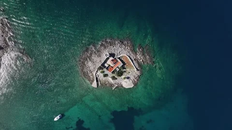 Aerial view of Otocic Gospa showcasing the serene beauty of the island, its Stock Footage 287787241