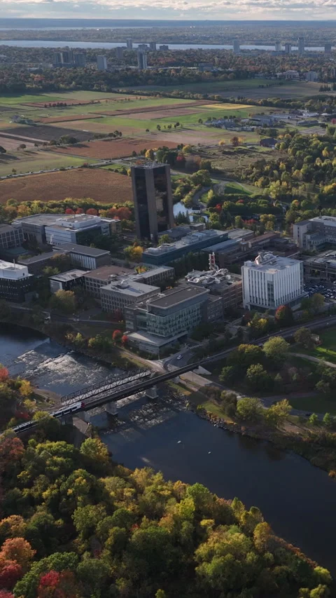 Aerial view of Ottawa Skyline over Carleton University and the Rideau River Stock Footage 337013182