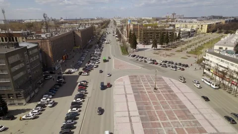 Aerial view of oval square in a city with low buildings and factory Stock Footage 287675071