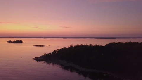 Aerial view over archipelago in the sunset 4K Stock Footage 113263838