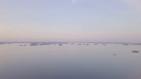 Aerial view over archipelago in the sunset 4K Stock Footage 113263941