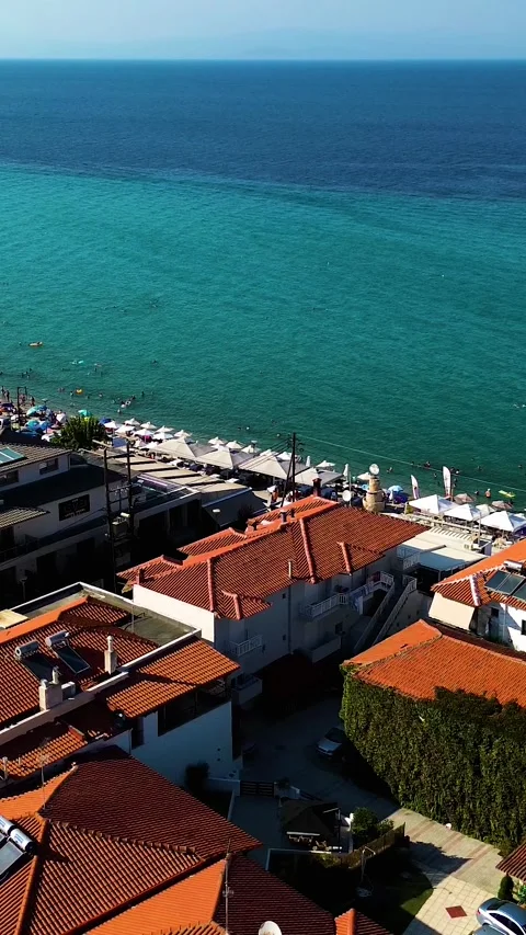 Aerial view over beach and town of Polychrono, Greece Stock Footage 342238533