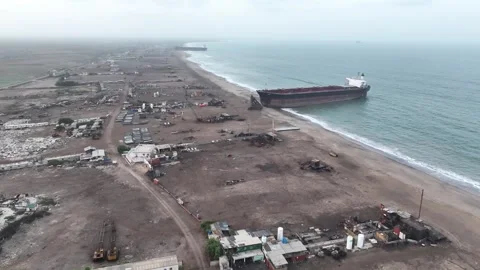 Aerial View Over Beach With Large Ship Beached At Gadani Breaking Yard. Stock Footage 254695012