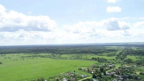 Aerial view over beatiful field scenery near town. Stock Footage 153129664
