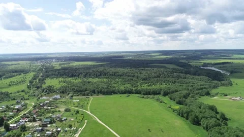 Aerial view over beatiful field scenery near town. Video stock 153921917