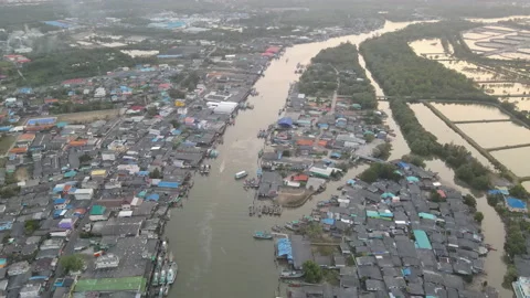 Aerial view over big river with some boats sail along the river in village Stock Footage 153399983