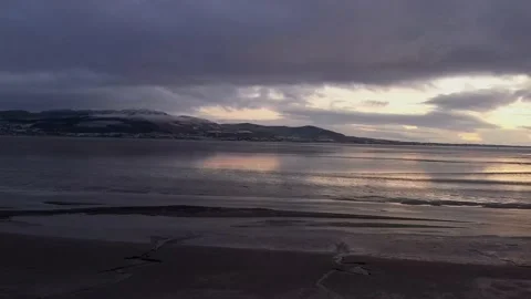 Aerial view over Blackrock beach at moody sunrise, Blackrock, Co. Louth, Ireland Stock Footage 220628987