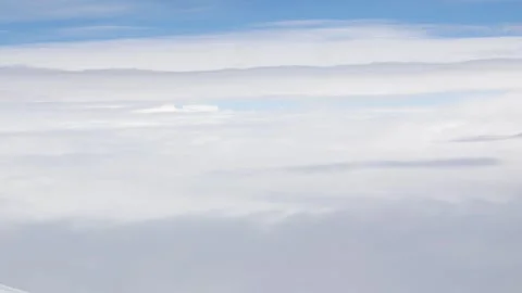 Aerial view over blue sky with white Fluffy clouds while flying through in .. Stock Footage 285298964