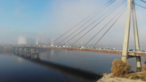 Aerial view over car bridge and city in the morning fog, Kyiv, Ukraine Stock Footage 98032835