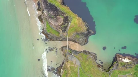 Aerial view over Carrick-a-Rede Bridge, Antrim, Ireland Stock Footage 220885556