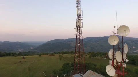 Aerial view over Cellphone radio telecommunication tower Stock Footage