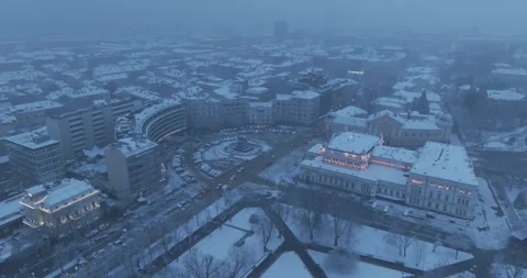Aerial view over the center of Sofia during a snowstorm at dusk Video stock 328312916