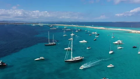 Aerial view over the clear beach and turquoise water of Formentera, Ibiza. Video stock 131239392