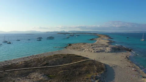 Aerial view over the clear beach and turquoise water of Formentera, Ibiza. Stock Footage 132976962
