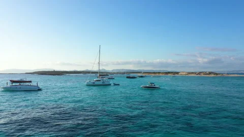 Aerial view over the clear beach and turquoise water of Formentera, Ibiza. 動画素材 148254446