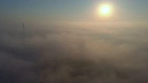 Aerial view over the clouds and sun is shining. Drone flying above clouds Stock Footage 97599872