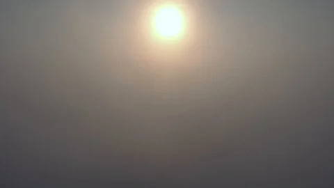 Aerial view over the clouds and sun is shining. Drone flying above clouds Stock Footage 97600289