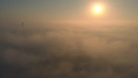 Aerial view over the clouds and sun is shining. Drone flying above clouds Stock Footage 97600717