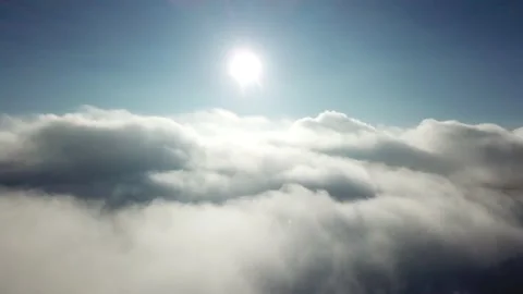 Aerial view over the clouds and sun Stock Footage 144812630