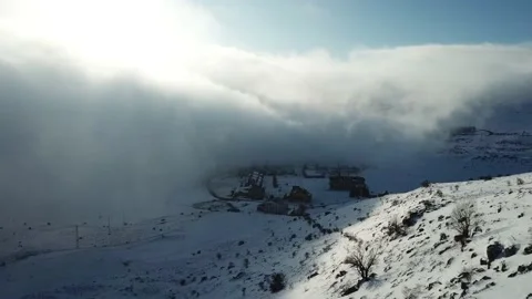 Aerial view over the clouds, mountain snow Stock Footage 144810383